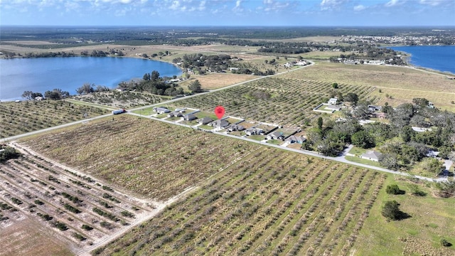 drone / aerial view featuring a rural view and a water view