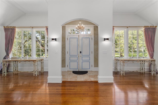 foyer entrance with hardwood / wood-style flooring and a wealth of natural light