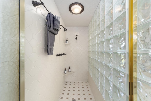 bathroom with a tile shower