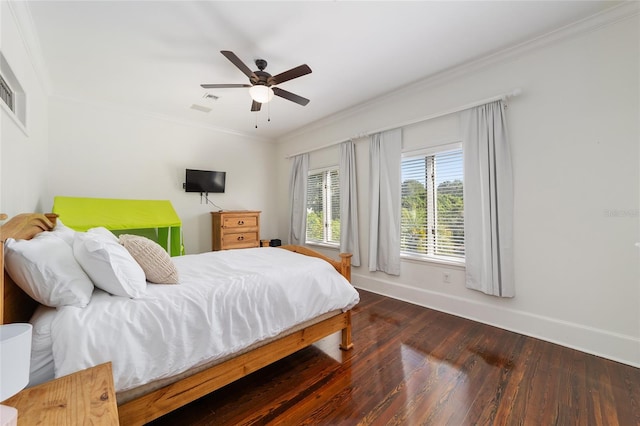 bedroom with dark hardwood / wood-style flooring, crown molding, and ceiling fan