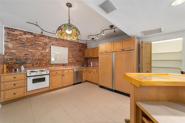 kitchen featuring paneled fridge, brick wall, decorative light fixtures, white electric stove, and stainless steel dishwasher