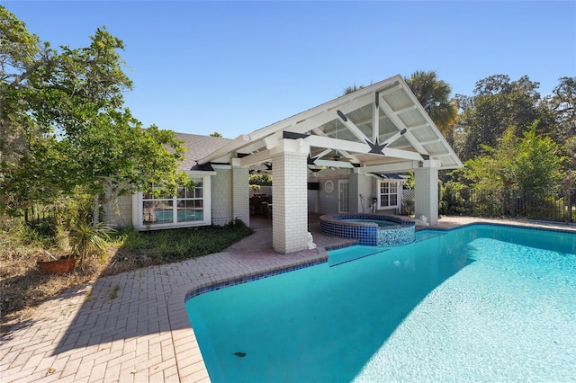 view of pool with a gazebo, an in ground hot tub, and a patio