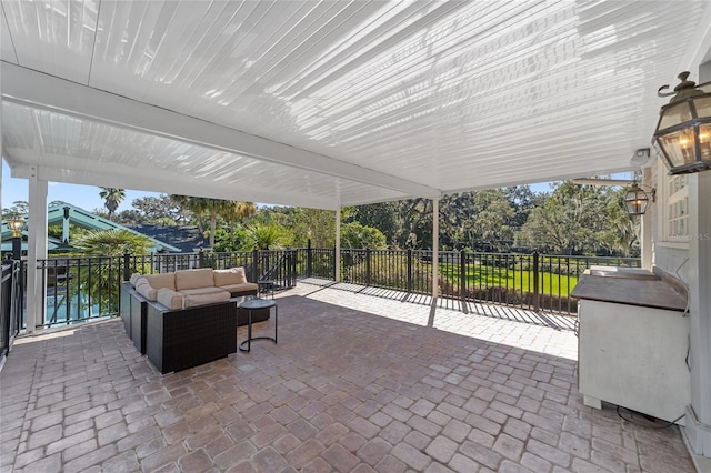 view of patio / terrace featuring a water view and outdoor lounge area