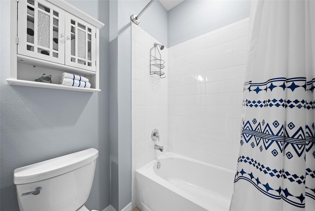 bathroom with shower / bathtub combination with curtain and toilet