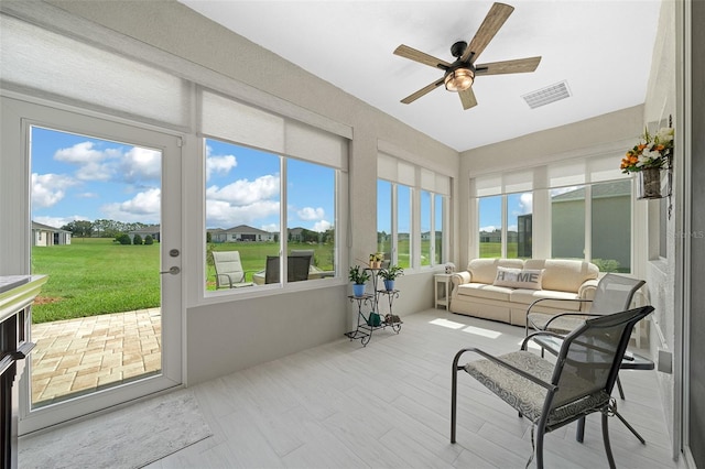 sunroom / solarium with ceiling fan