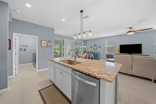 kitchen featuring dishwasher, white cabinetry, a kitchen island with sink, and sink