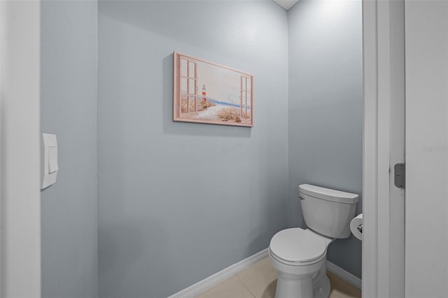 bathroom featuring tile patterned flooring and toilet