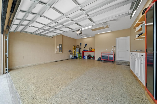 garage featuring electric panel and a garage door opener