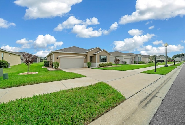 ranch-style home with a garage and a front lawn