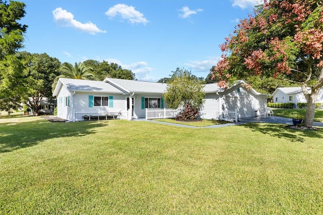 ranch-style house with a porch and a front lawn