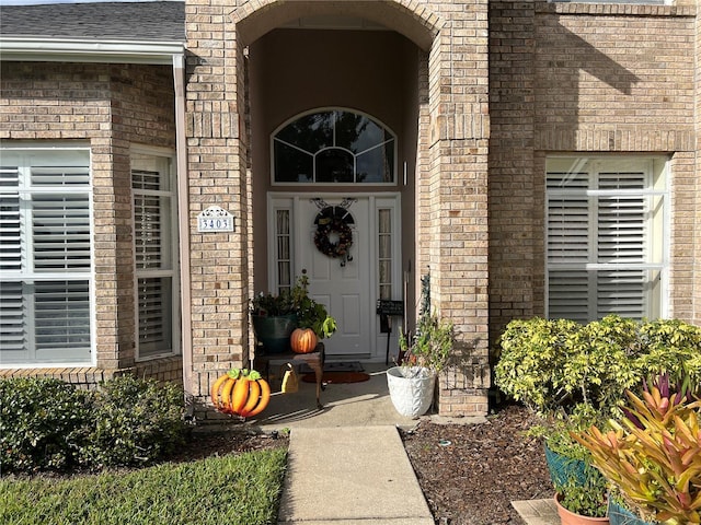 3403 Gatlin Place Cir, Orlando, FL 32812 - property entrance with brick siding and roof with shingles