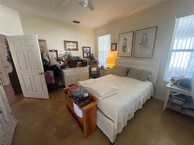 carpeted bedroom with multiple windows and visible vents