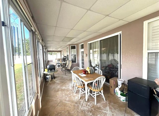 sunroom featuring a paneled ceiling