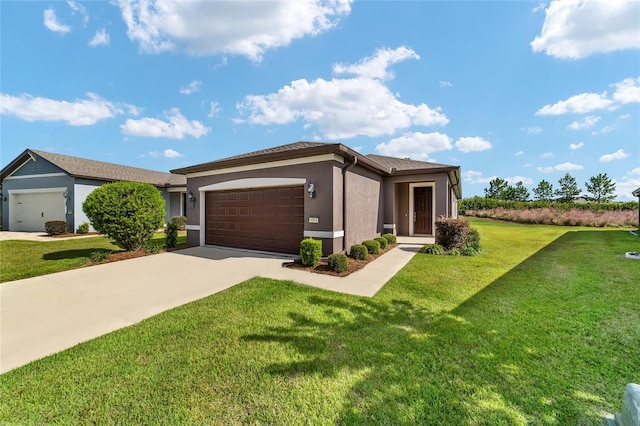 view of front of house featuring a front lawn and a garage