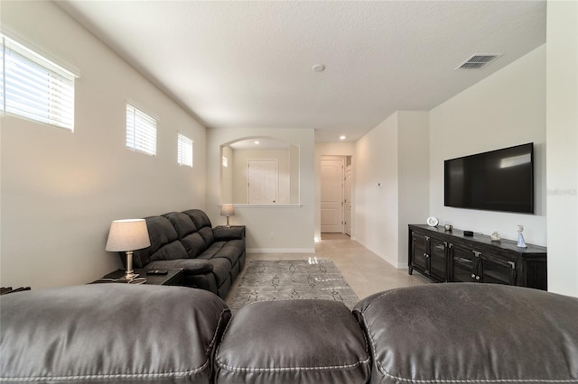 living room featuring a textured ceiling