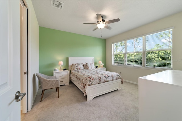 carpeted bedroom with a closet and ceiling fan