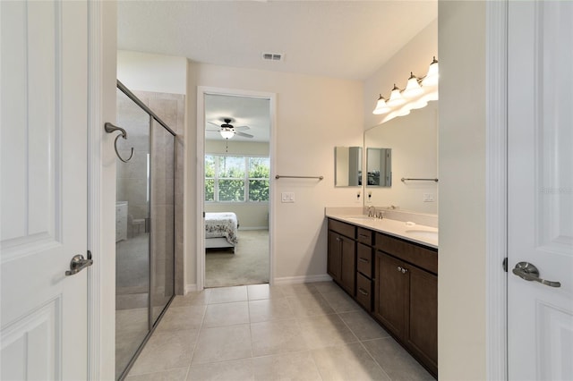 bathroom featuring vanity, an enclosed shower, ceiling fan, and tile patterned flooring