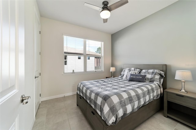 bedroom featuring light tile patterned floors and ceiling fan