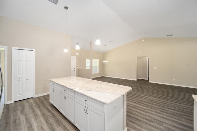 kitchen featuring a kitchen island, hanging light fixtures, vaulted ceiling, white cabinets, and dark wood-type flooring