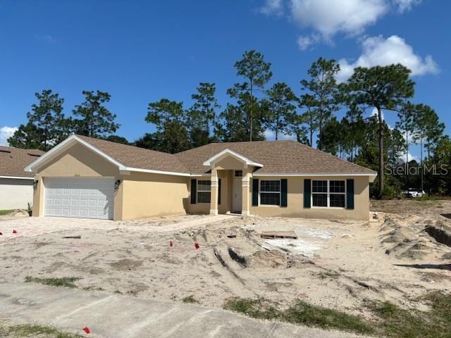 view of front of property with a garage