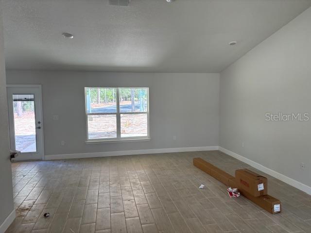 spare room featuring hardwood / wood-style floors