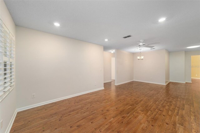 unfurnished room with hardwood / wood-style floors, a textured ceiling, and ceiling fan