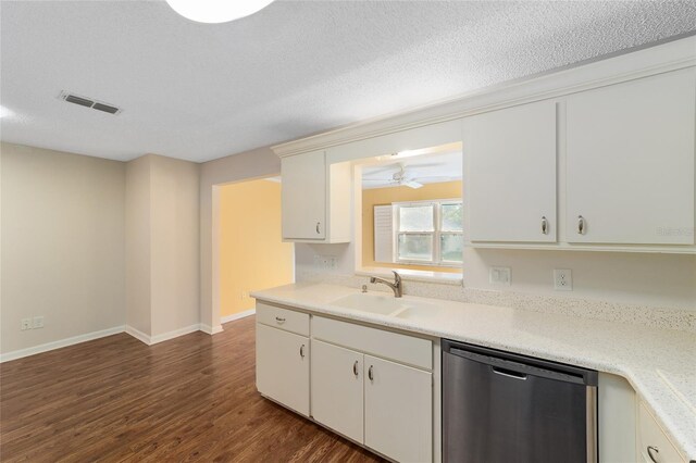 kitchen with dishwasher, sink, a textured ceiling, white cabinets, and dark wood-type flooring