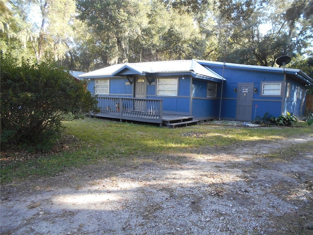 view of front facade with a wooden deck