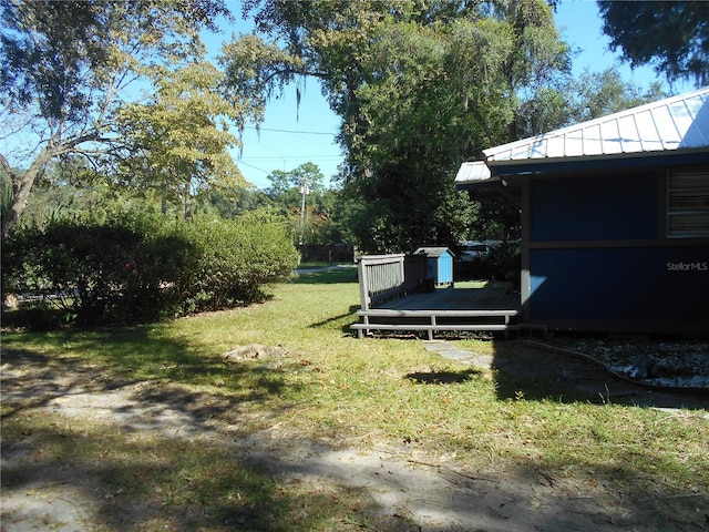 view of yard with a wooden deck