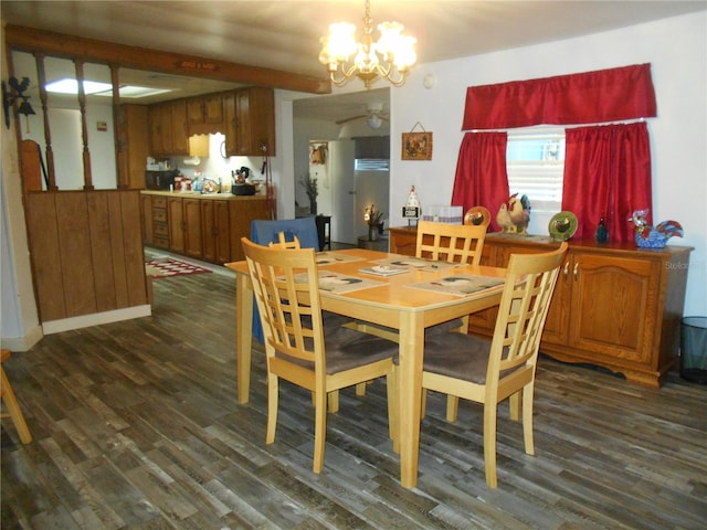 dining space featuring a chandelier and dark hardwood / wood-style flooring