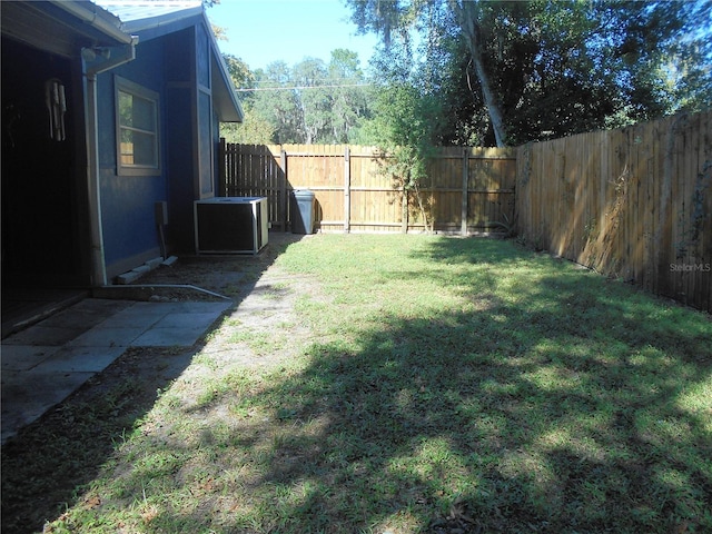 view of yard with central AC