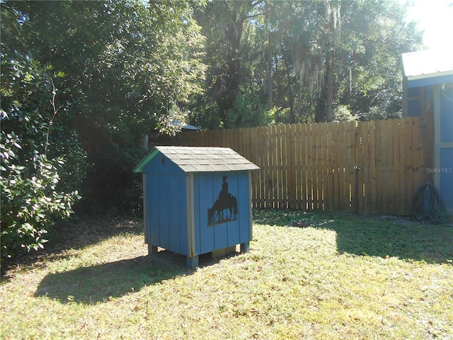 view of outbuilding with a lawn