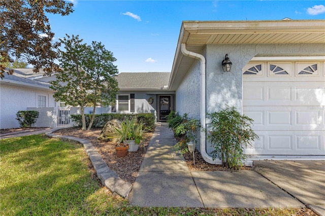 entrance to property with a garage