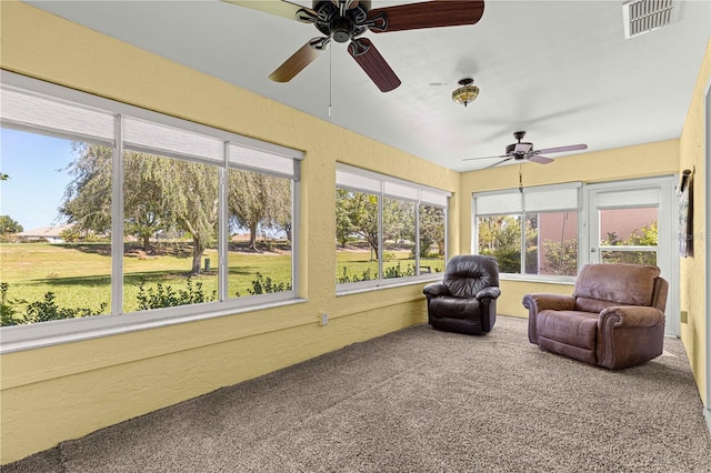 sunroom with ceiling fan