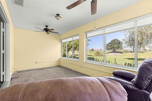 sunroom with ceiling fan