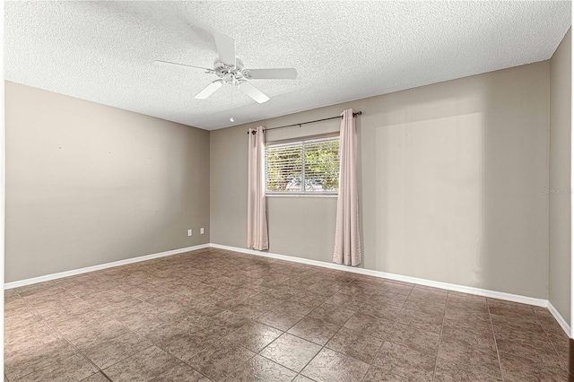 spare room with ceiling fan and a textured ceiling