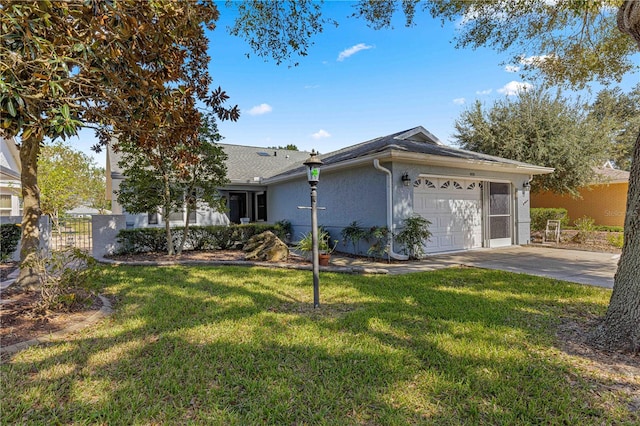 single story home with a front yard and a garage