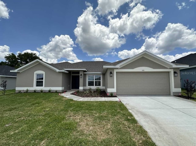 single story home featuring a front lawn and a garage