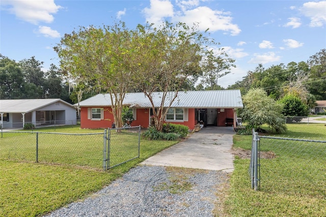 ranch-style home featuring a front yard and a carport