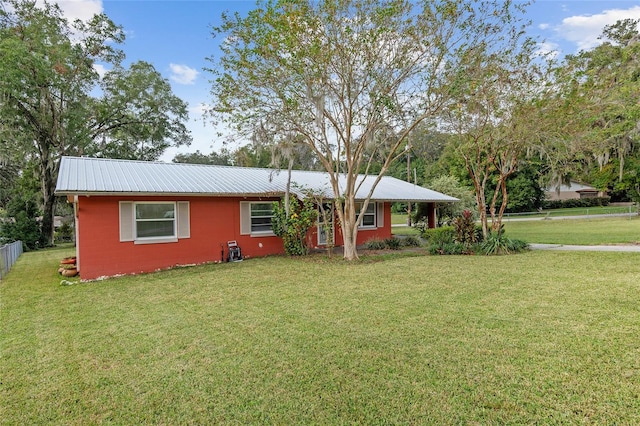 ranch-style home with a front yard