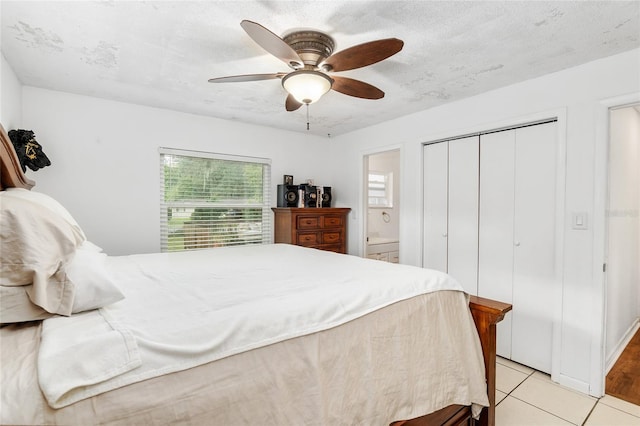2810 SE 8th St, Ocala, FL 34471 - bedroom with a closet, a ceiling fan, light tile patterned floors, and ensuite bath