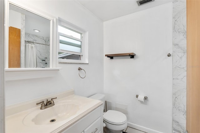 bathroom featuring vanity, a shower with curtain, and toilet