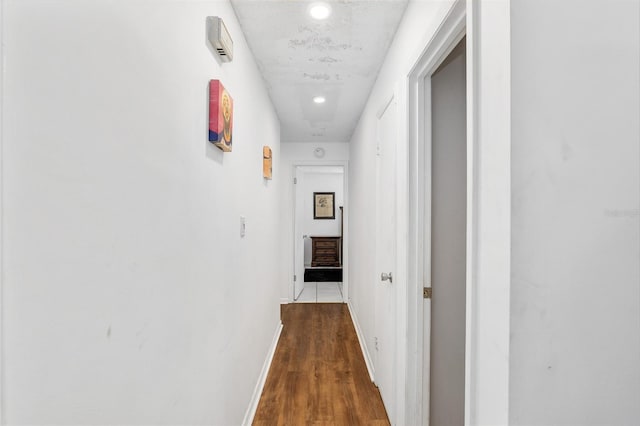 hall with hardwood / wood-style floors