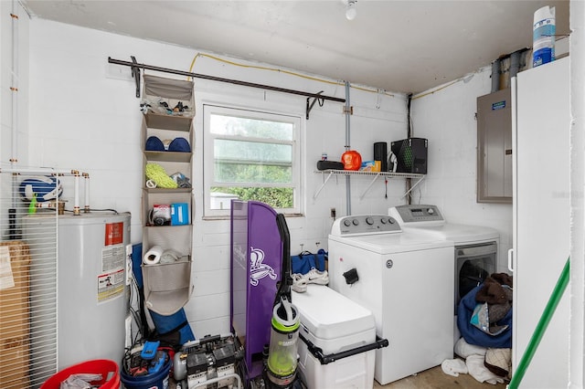 laundry area featuring electric panel, washer and clothes dryer, and water heater