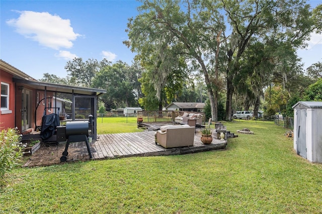 view of yard with a shed and a deck