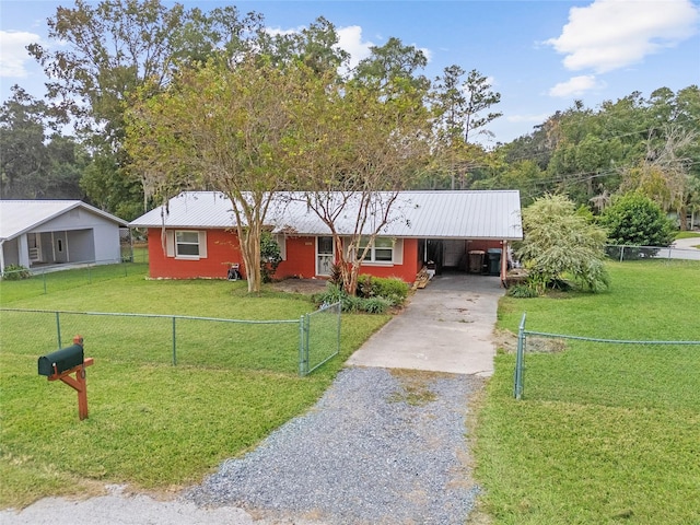 single story home with a front yard and a carport