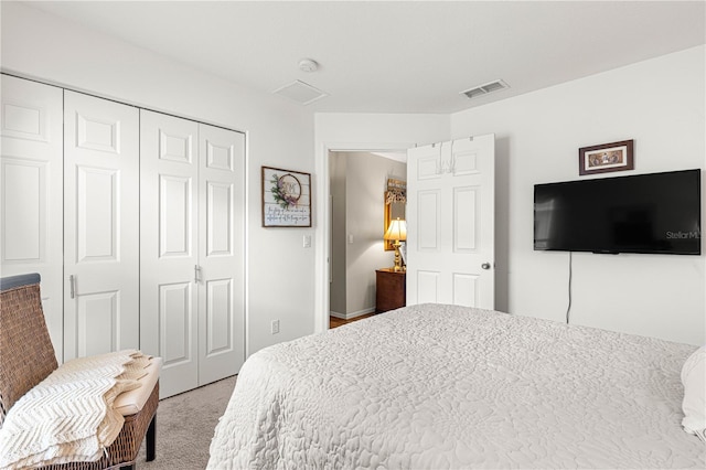 bedroom with a closet and carpet floors