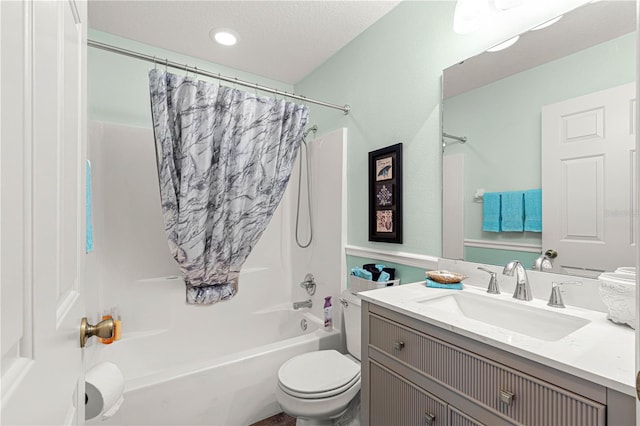 full bathroom featuring vanity, a textured ceiling, toilet, and shower / bath combo with shower curtain