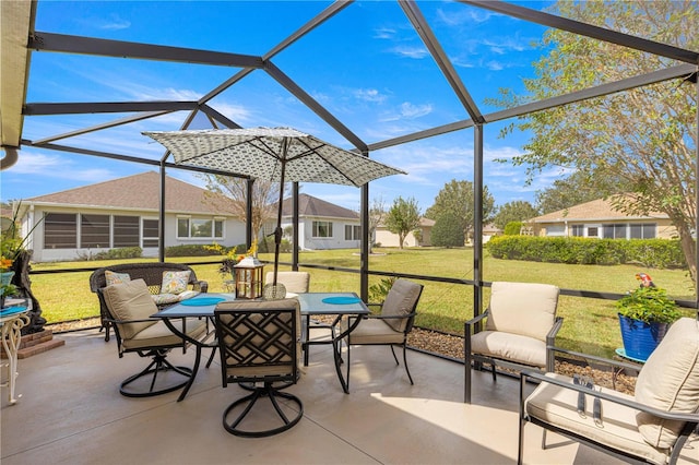 view of patio featuring glass enclosure