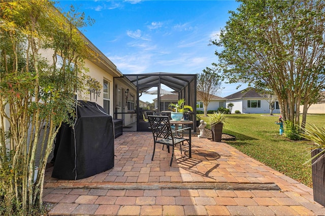 view of patio / terrace with a lanai and grilling area